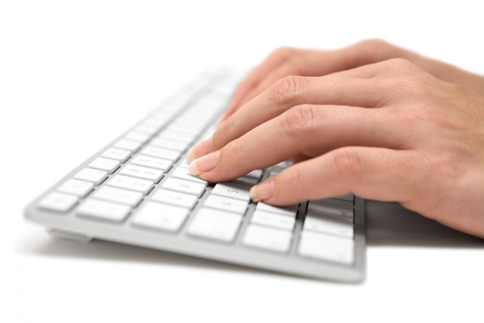 hands-typing-silver-keyboard