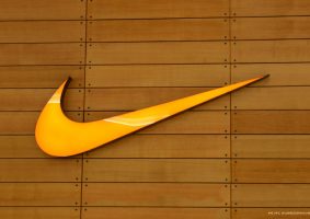 Nike Swoosh Logo on a Wooden Wall